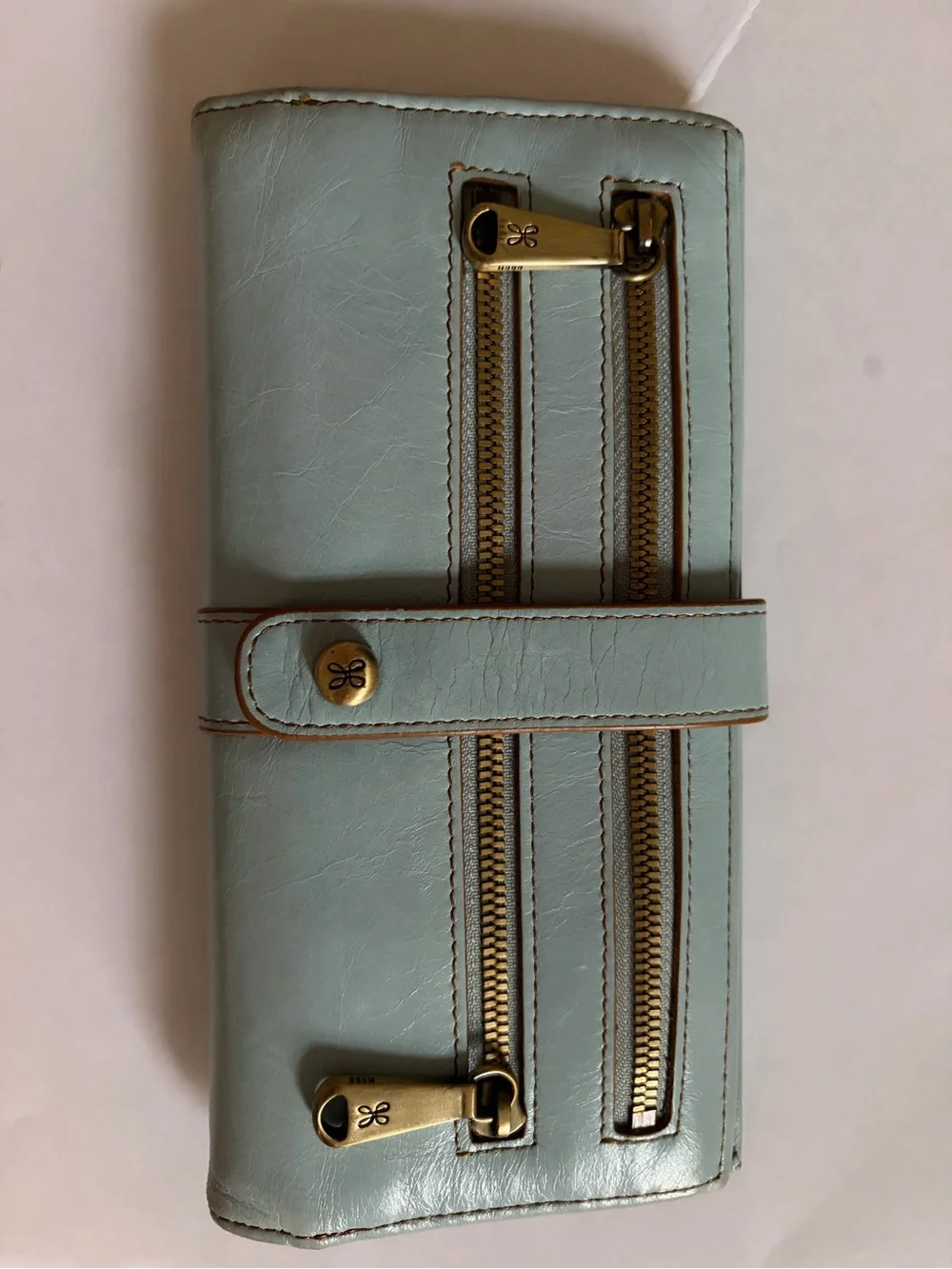 HOBO light blue leather wallet with brass hardware